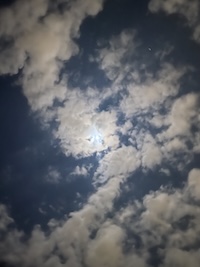 picture of the moon with clouds overlapping it