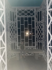 My nephew sitting on a bench